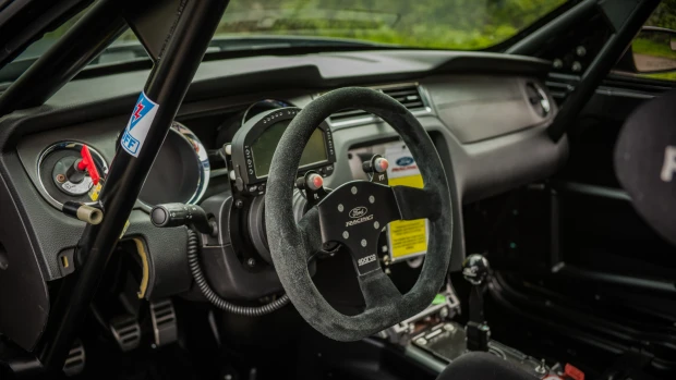 Ford Mustang Boss 302S with adjustable rear wing, carbon fiber front splitter, and standard competition components